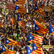 Pro-independence supporters wave Catalan separatist flags, known as "Estelada", as they attend a demonstration in Barcelona